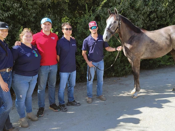 Students pose with their University of Arizona-bred yearling “Kayak”.